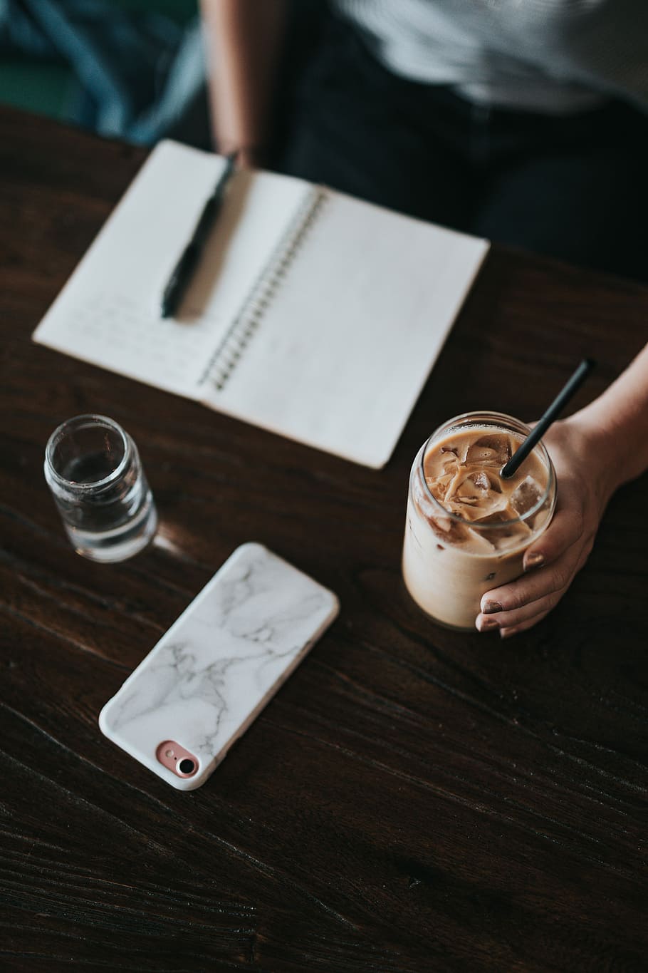 person holding cup of coffee, person holding clear glass with cream liquid HD wallpaper