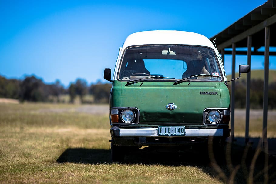 green and white Toyota vehicle parked near shed, parked Toyota van HD wallpaper