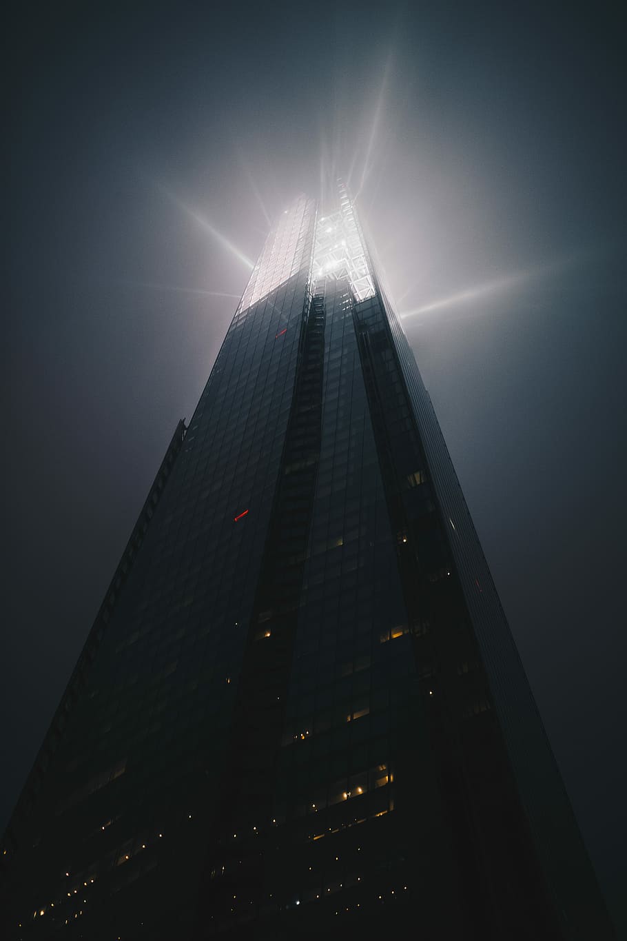 low angle photo of high-rise building under cloudy sky at daytime HD wallpaper