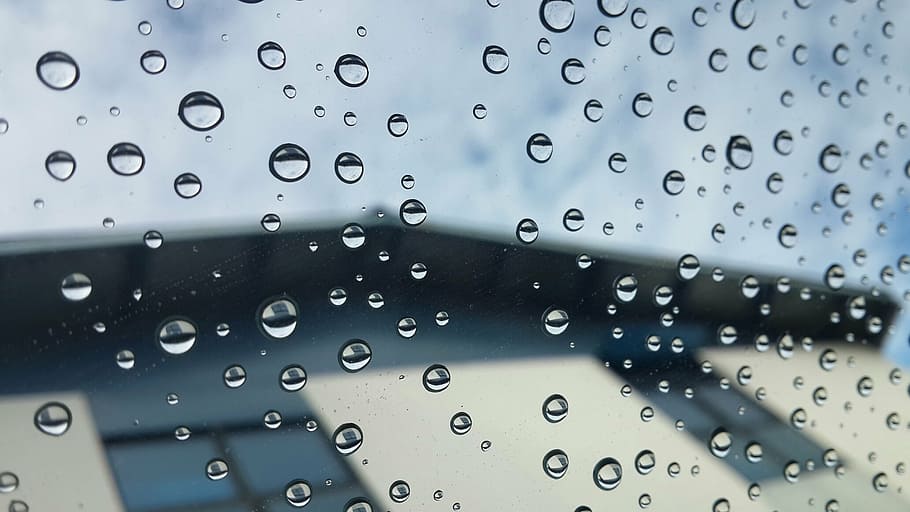 selective focus photography of water droplets on clear glass sheet HD wallpaper