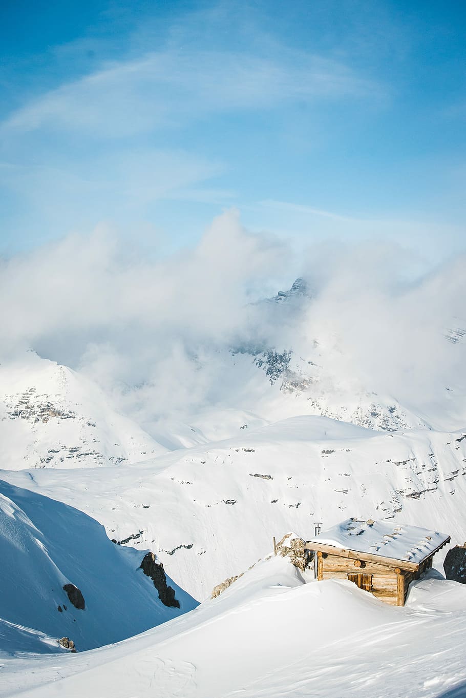 sunlight over snow covered mountain, photo of snow-covered hills under clear blue sky HD wallpaper