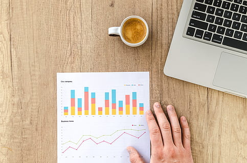 white ceramic mug beside laptop computer, chart, graph, finance HD wallpaper