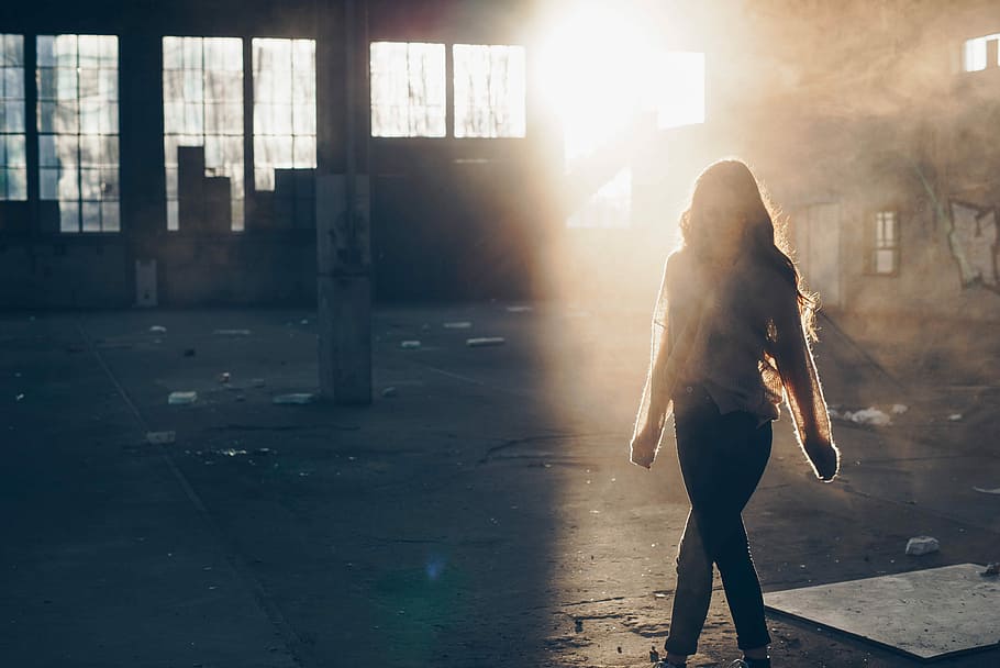 woman walking near the building, sunlight passing through standing woman HD wallpaper