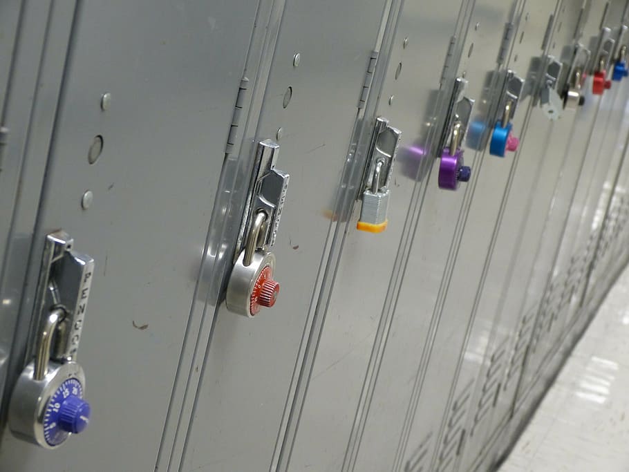 combination locks and padlocks on closed lockers inside room HD wallpaper