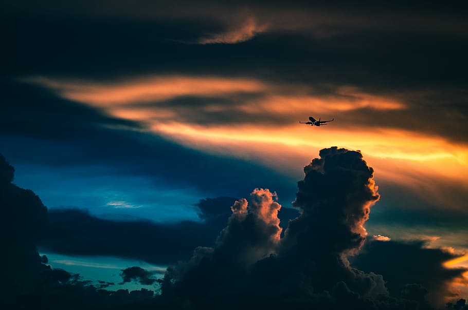 silhouette of plane under cloudy skies, silhouette of a plane flying above the sky HD wallpaper