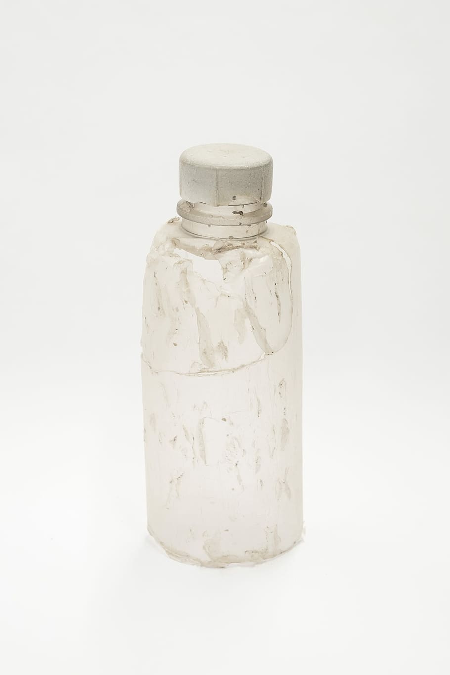 Ocean Plastic, clear water bottle with gray cap, damaged bottle