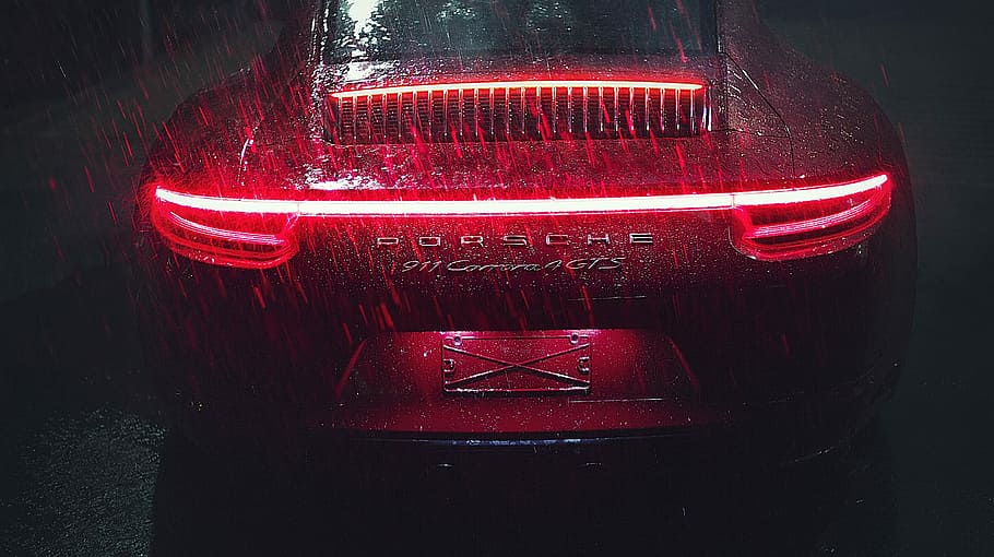 MX Porsche 911, red Porsche 911 Carrera GTS taillight turned on during rain