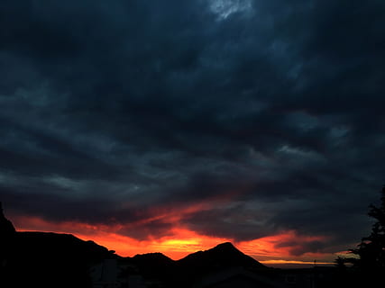 high rise mountain, sunset, red, orange, dark sky, dark clouds HD wallpaper