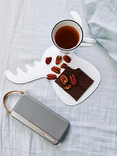 walnuts on white tray beside cup of coffee, white ceramic mug beside gray portable speaker HD wallpaper