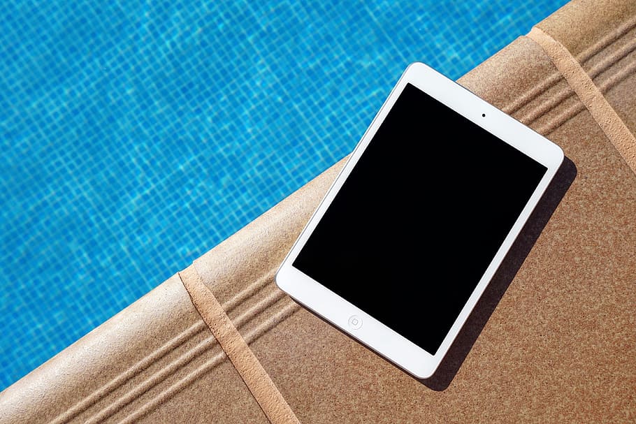white iPad beside swimming pool, white iPad, water, tablet, no People