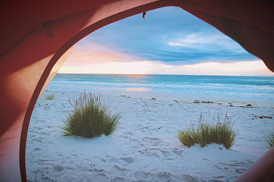 pink tent near white sand near sea, photo of ocean waves near seashore during daytime HD wallpaper