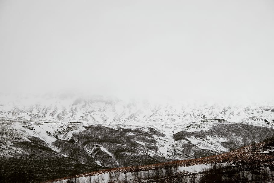 Snow-capped Icelandic mountains, white mountain under cloudy sky HD wallpaper
