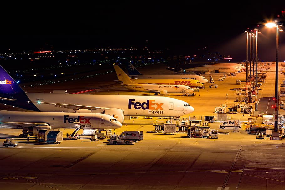 FedEx airliner near turned-on light post, Airport, Cgn, konrad adenauer
