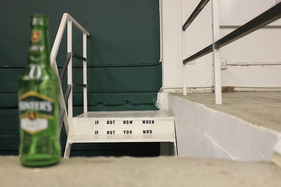 green glass bottle standing near gray concrete stair, clear green glass bottle HD wallpaper