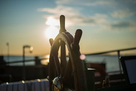 selective focus photo of brown wooden ship steering wheel, closeup HD wallpaper