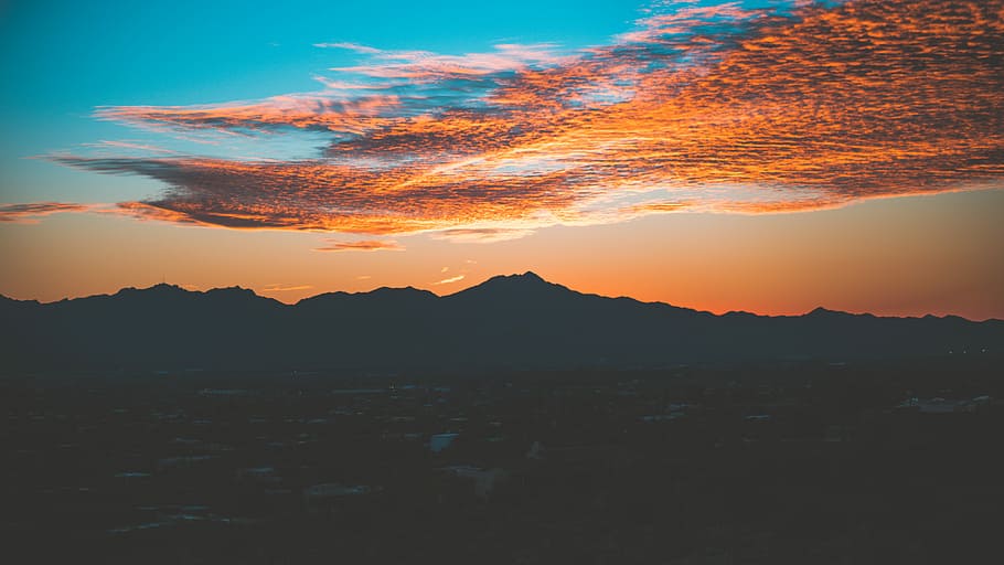silhouette of mountain under cloudy sky photo taken during sunset, landscape photography of mountain during golden time HD wallpaper
