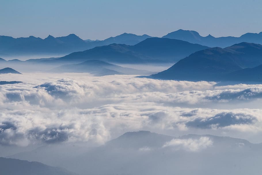 gray mountains surrounded by clouds in aerial photography, white cloud formation and mountain HD wallpaper