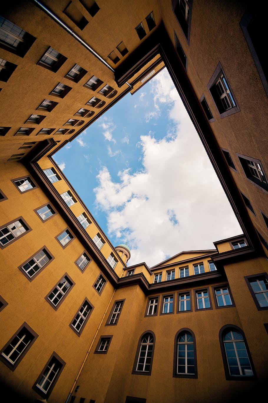 low-angle photography of yellow concrete building, low-angle shot photography of buildings HD wallpaper