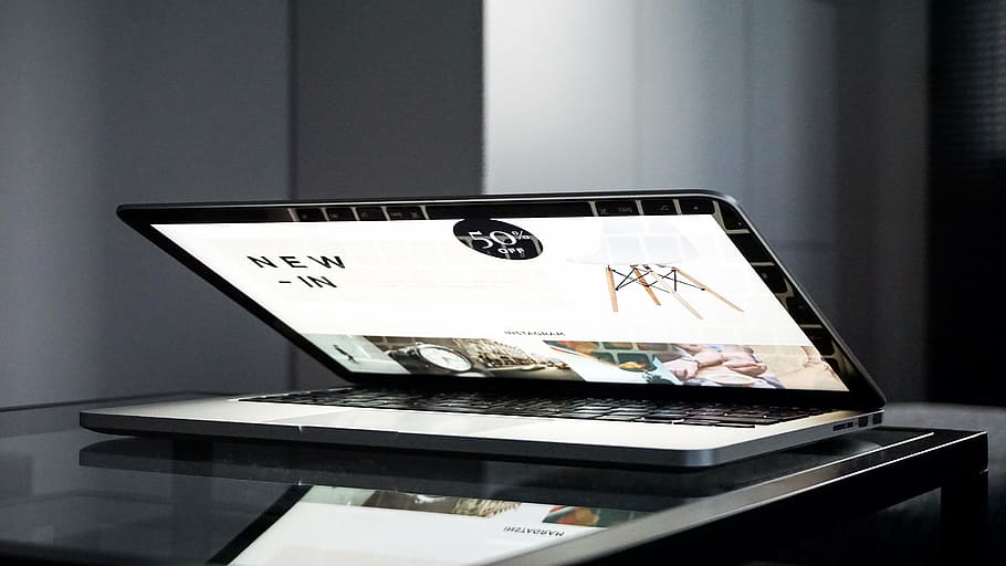 MacBook Pro turned-on on black wooden table, laptop, computer HD wallpaper