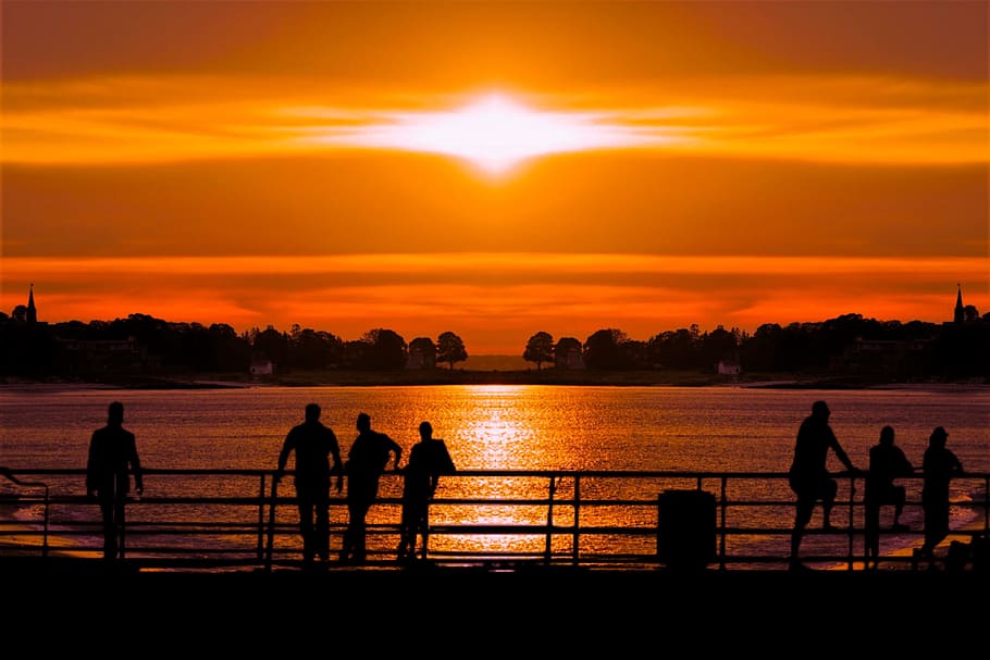 silhouette of people standing beside handrail, sunset, water HD wallpaper