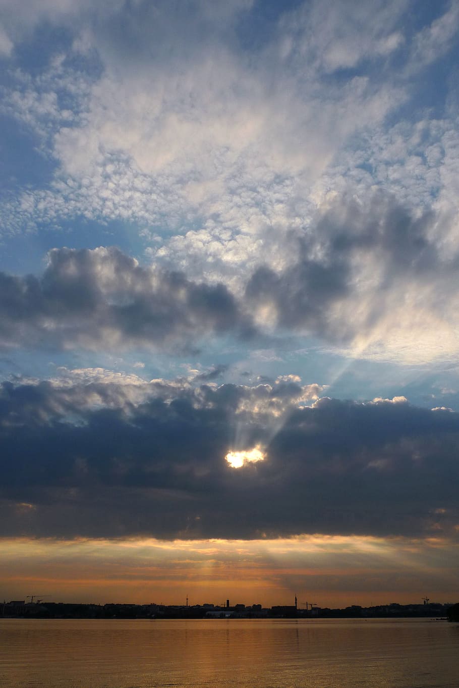 sun covered by cumulus clouds over body of water, sky, sunset HD wallpaper