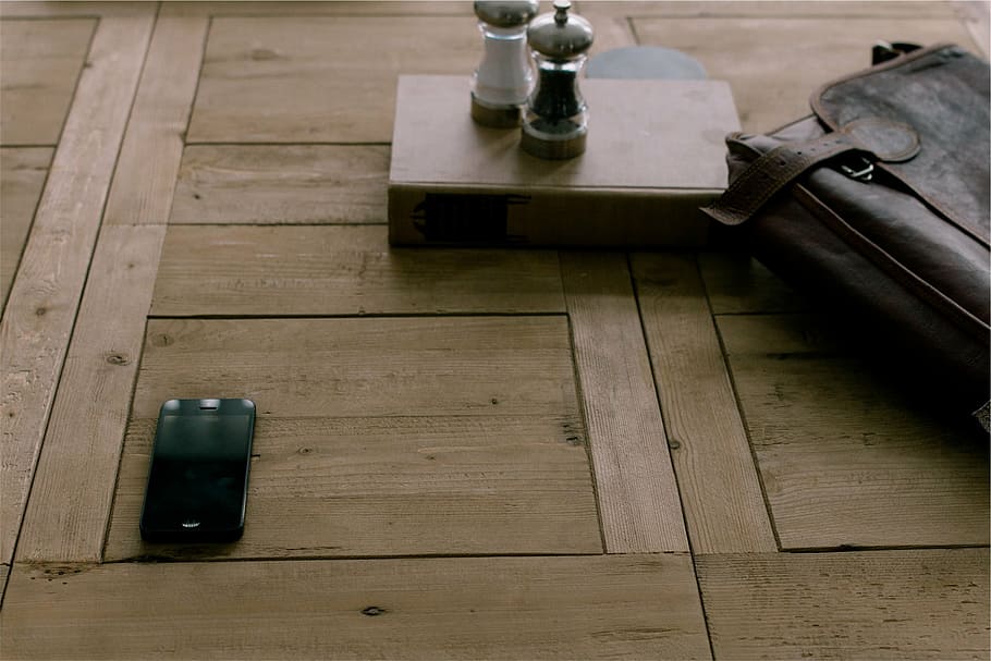 two clear glass condiment shakers on brown box, leather, satchel HD wallpaper