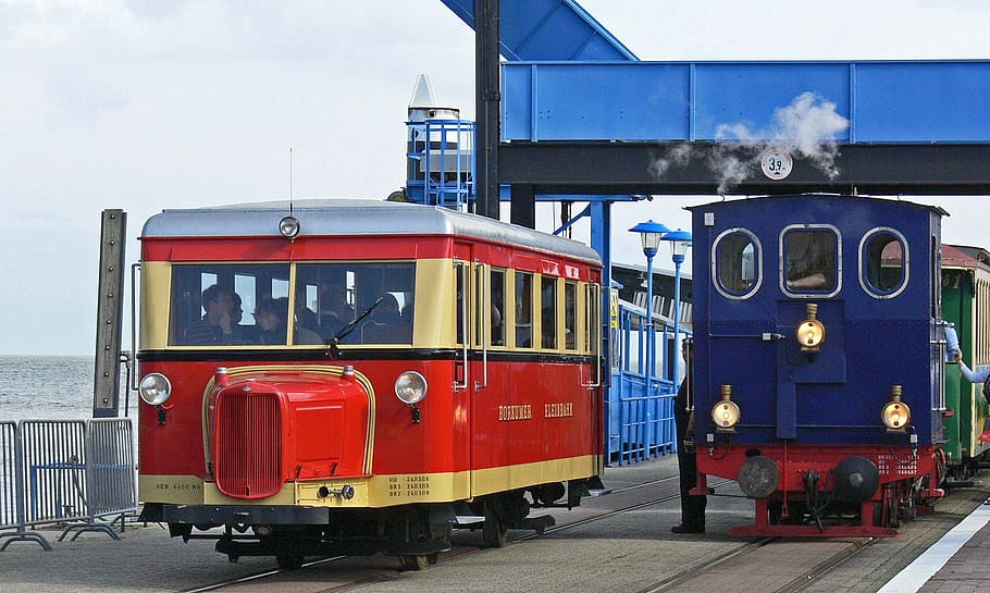 two blue and red trains travelling at daytime, borkum, small ground, HD wallpaper