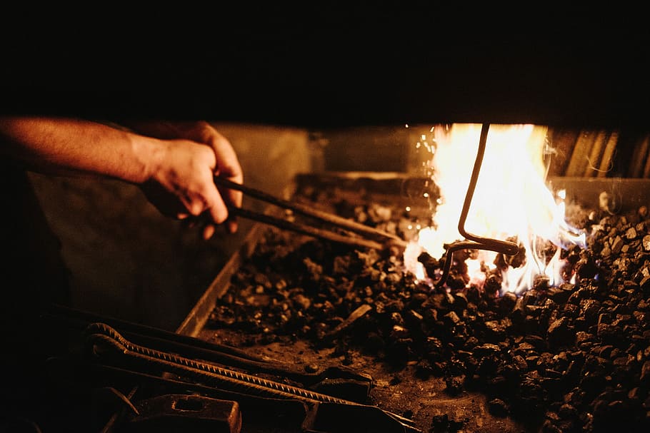 person holding black metal tong near fire, fire - Natural Phenomenon HD wallpaper