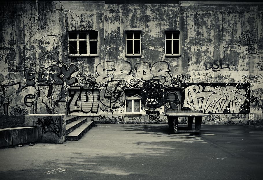 grayscale photo of building with paintings, berlin, graffiti