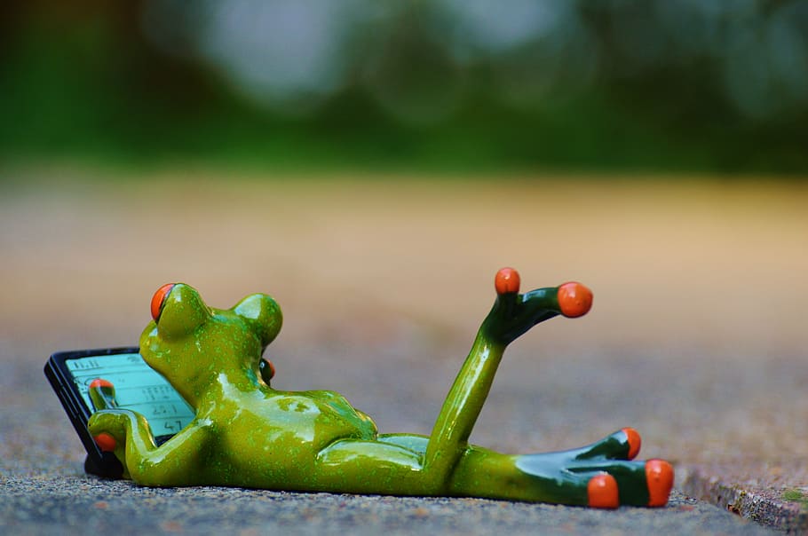 green frog figurine on brown surface, computer, relaxed, figure HD wallpaper