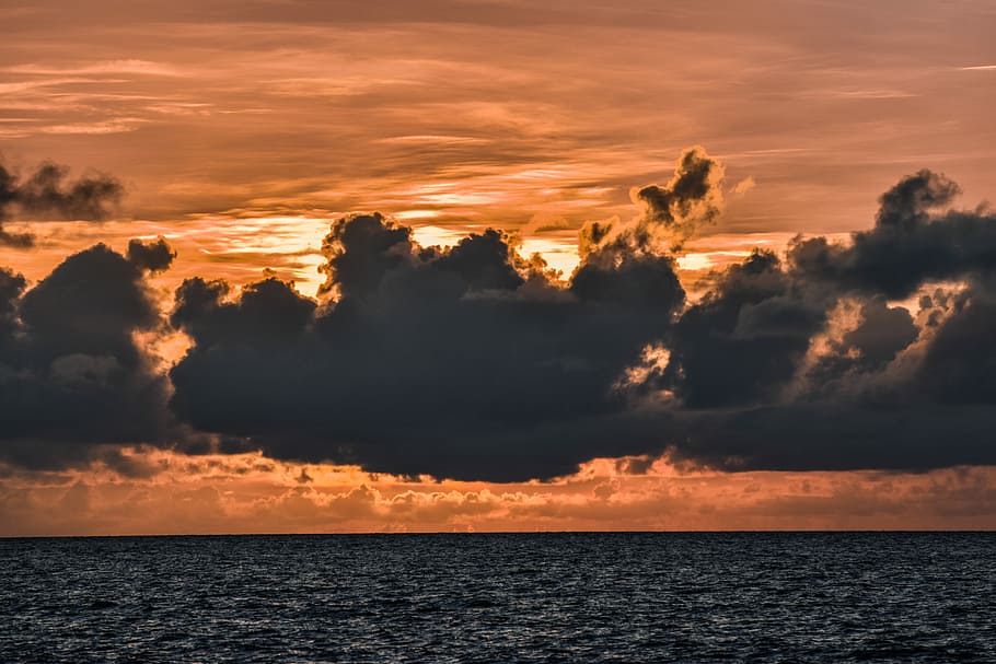 sea of clouds above body of water, body of water during sunset HD wallpaper