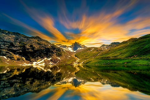 photo of body of water near green mountains during day time HD wallpaper