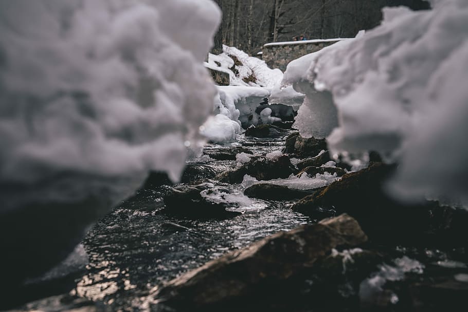 river coated with snow, focus photography of river with rocks HD wallpaper