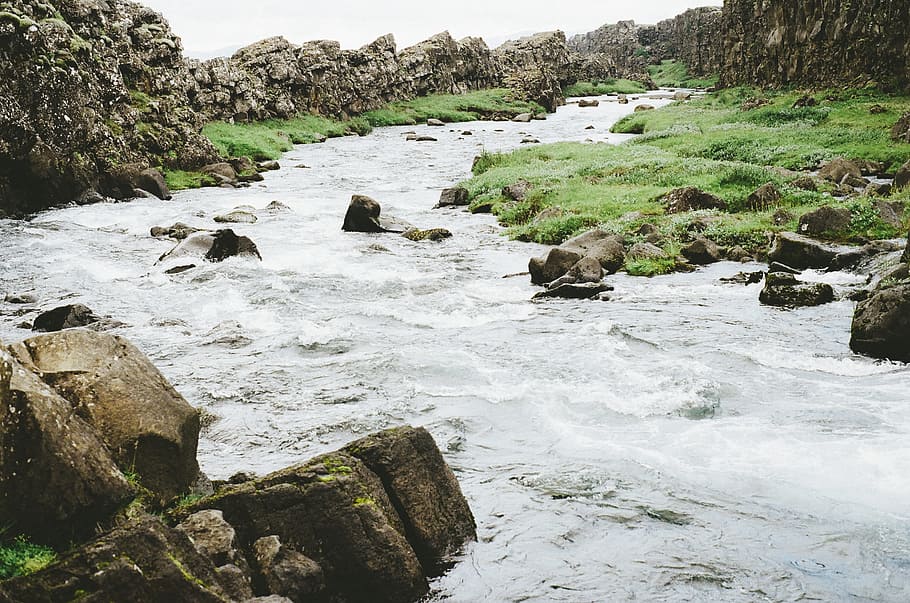lake surrounded of stones, river, stream, water, rocks, boulders HD wallpaper