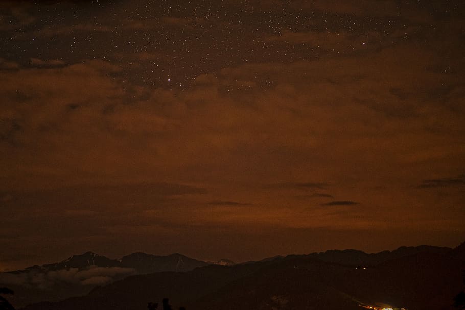 silhouette photo of mountain under nimbus clouds, silhouette of mountain during night time HD wallpaper