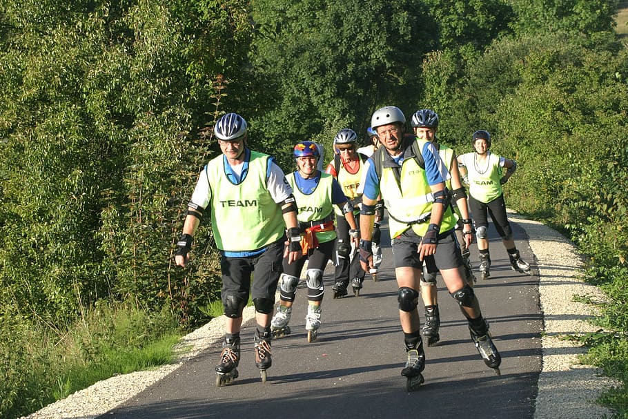 crowd of people inline skating on gray asphalt road at daytime HD wallpaper