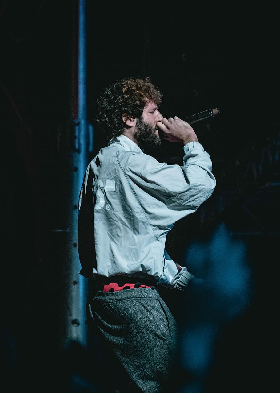 man holding cordless microphone on stage, man singing, male, singer HD wallpaper
