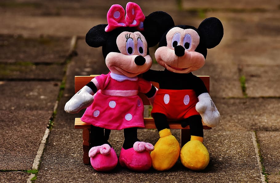 Disney Minnie & Mickey Mouse plush toy sitting on bench, mice