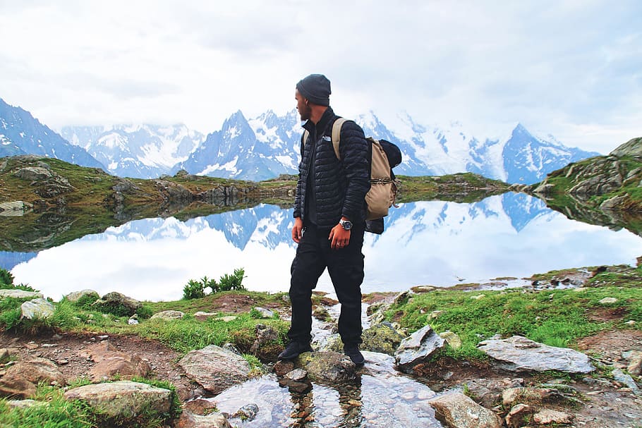 A man stands in the mountains in Chamonix, France, people, adventure