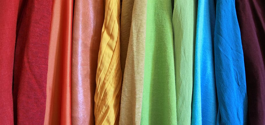 assorted-color textile lot, close up, photo, yellow, blue, orange