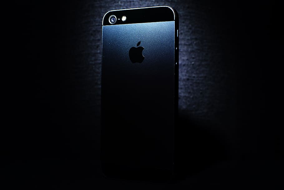 black iPhone 5 against black background, apple, communication