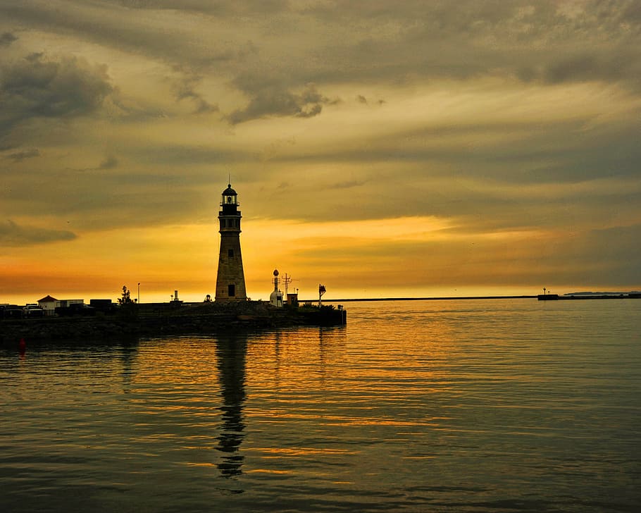 lighthouse across body of water, lake erie, buffalo, sunset, orange, HD wallpaper