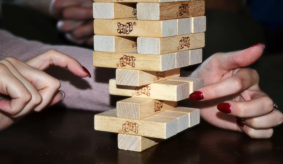 person playing jenga blocks, balance, sensitivity, stability HD wallpaper