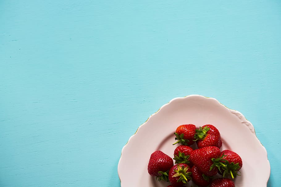 flat lay photography of bunch of strawberries on white plate, strawberries on plate HD wallpaper