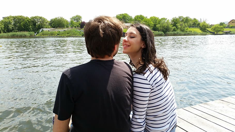 woman beside man sitting on dock, lake, love, look, female, couple