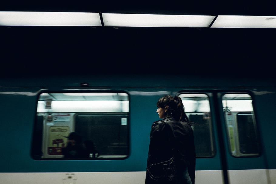 woman standing near closed train door, woman in black coat near train HD wallpaper