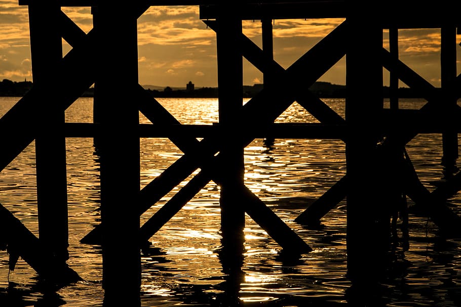 Sunset, Silhouette, Pier, Lake, Water, dark, trunks, yellow HD wallpaper
