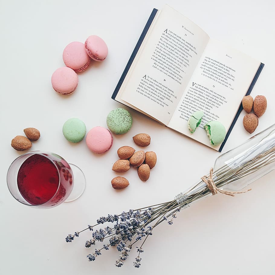 Relax with macarons, drink and a book, dessert, top view, white background