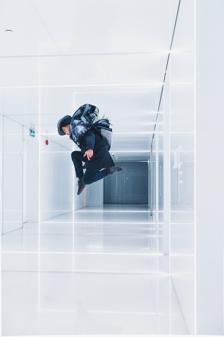 man jumping in hallway, building, white, indoor, wall, floor HD wallpaper
