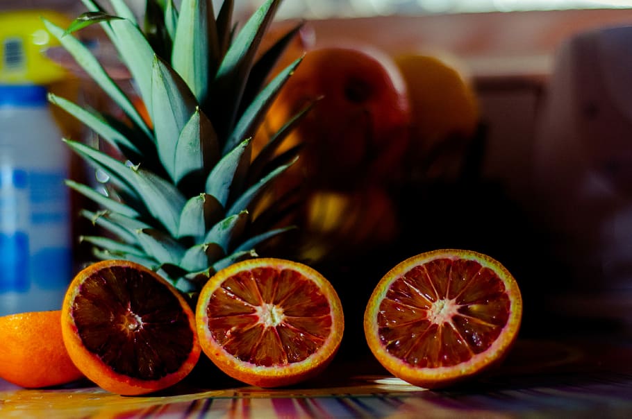 Retrorange, sliced blood orange fruits and pineapples on table HD wallpaper